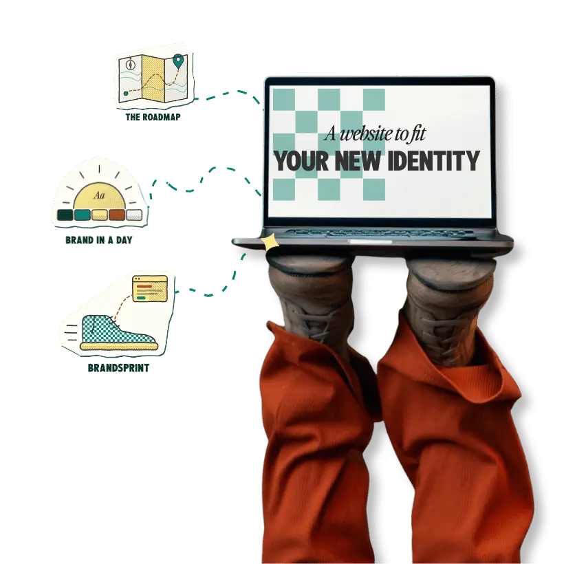 Laptop showing "Your New Identity" surrounded by brand kit elements, with feet in orange pants propped beside it