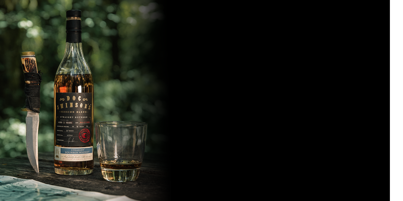 Doc Swinson’s whiskey bottle and glass on a dark background